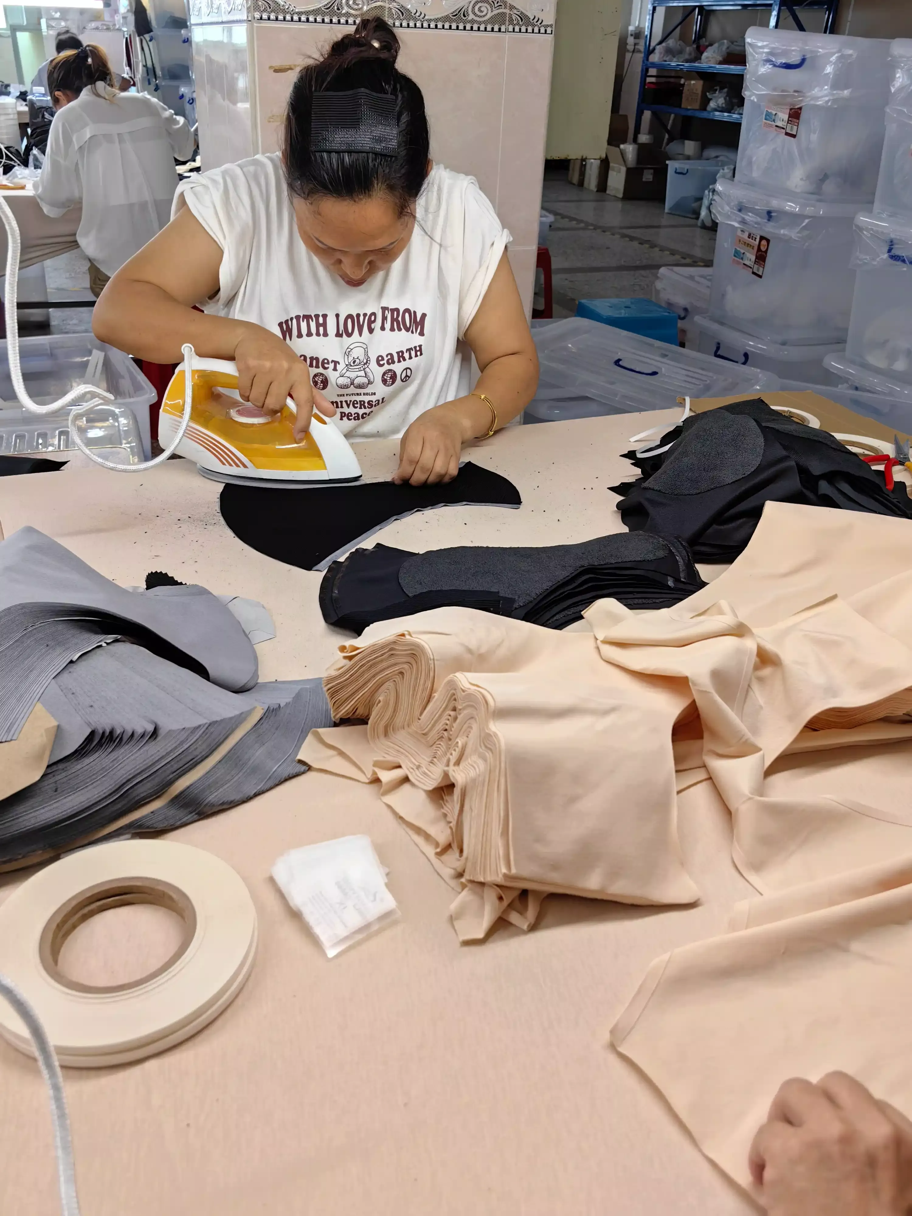 Technician applying seamless ultrasonic bonding for zero-ridge period underwear leg openings